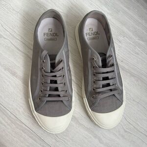 Authentic Fendi men’s sneakers in a refined grey tone.